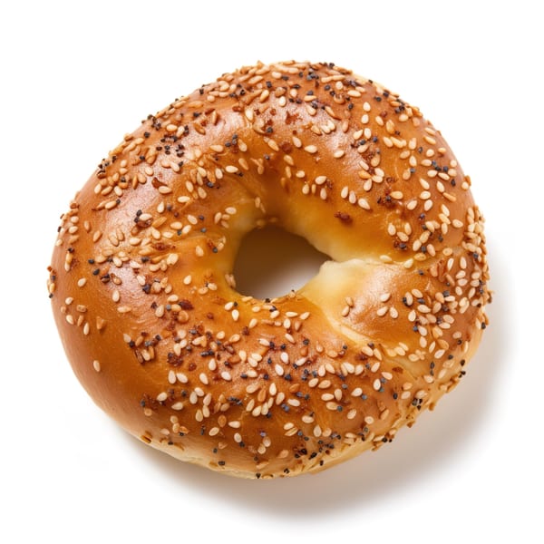 Grace Deli's everything bagel, topped with sesame seeds and poppy seeds, on a white background.