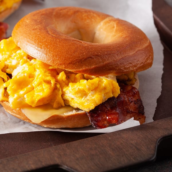 Grace Deli's breakfast bagel with scrambled eggs, melted cheese, and crispy bacon.